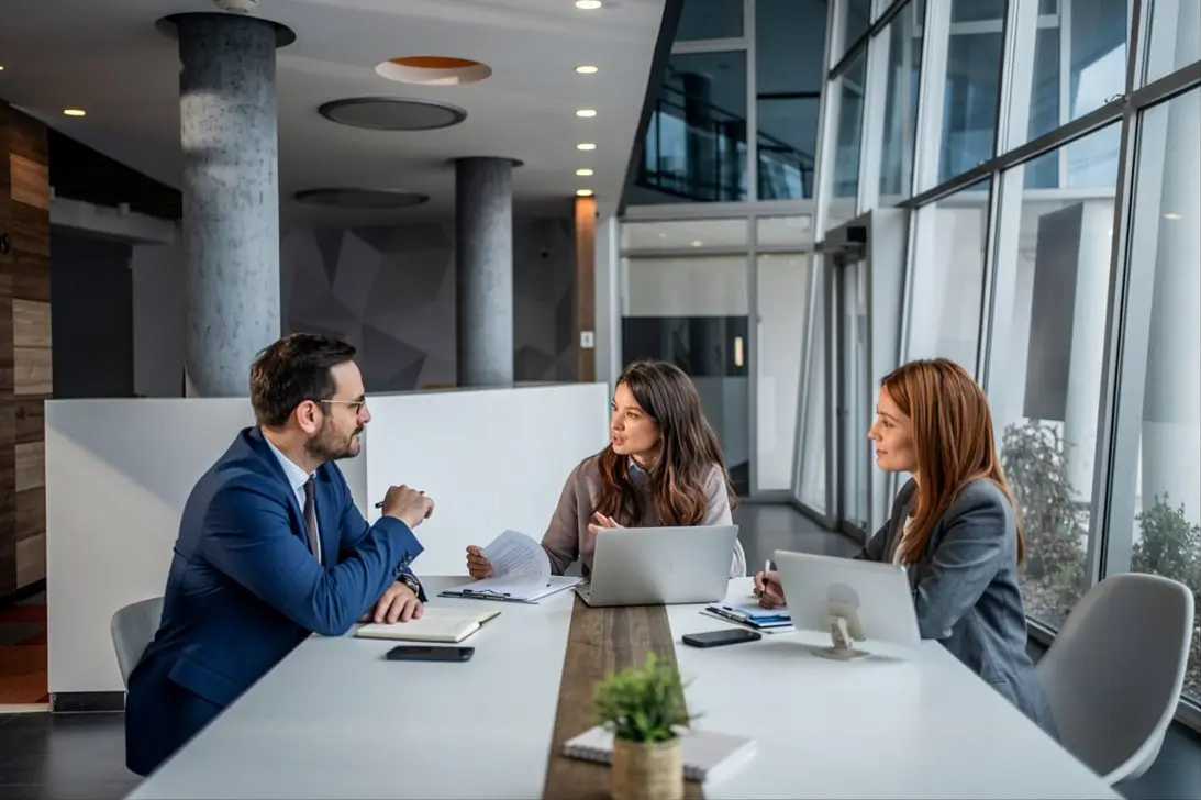 Business team analyzing data while developing an artificial intelligence implementation strategy
