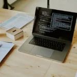 Clean minimalist developer workspace illustrating github copilot vs cursor composer workflow comparison on a screen.
