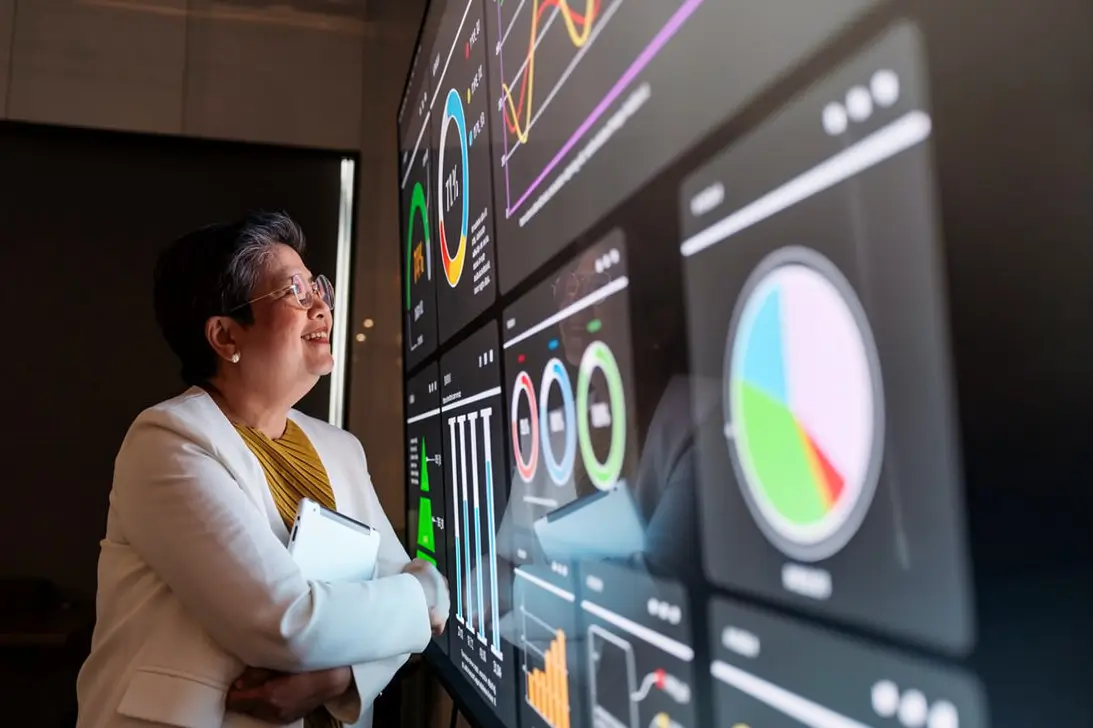 Business leaders reviewing AI Compliance Management KPIs on an enterprise governance dashboard