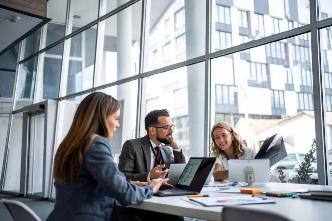 Business professionals reviewing AI monitoring dashboards and enterprise analytics for model performance optimization.