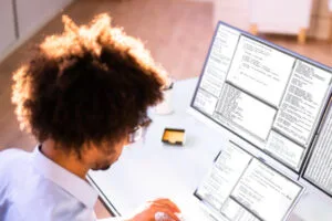 Developer debugging software crashes on multiple screens